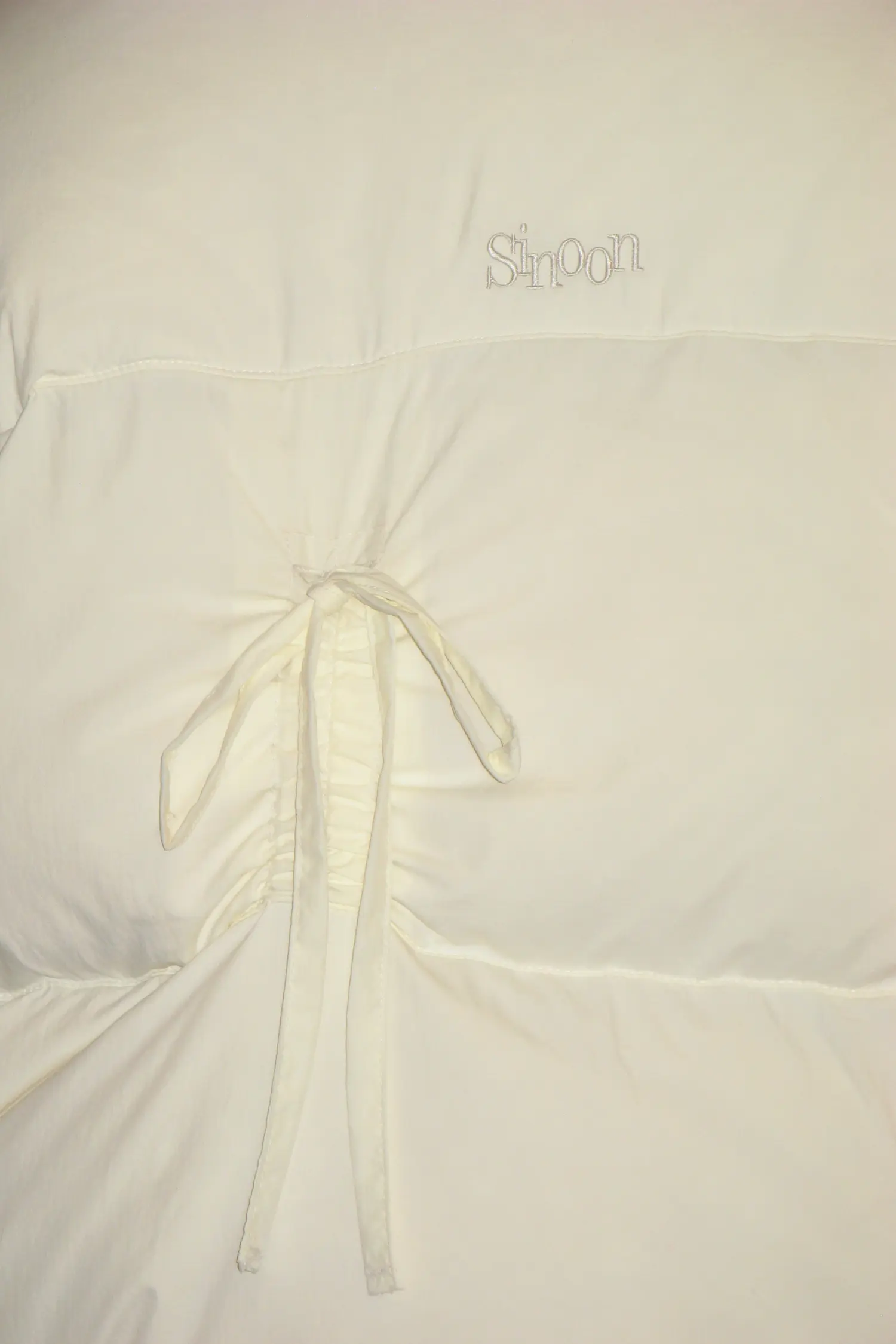 MUSINSA | SINOON RIBBON DETAIL PUFFER JACKET (IVORY)